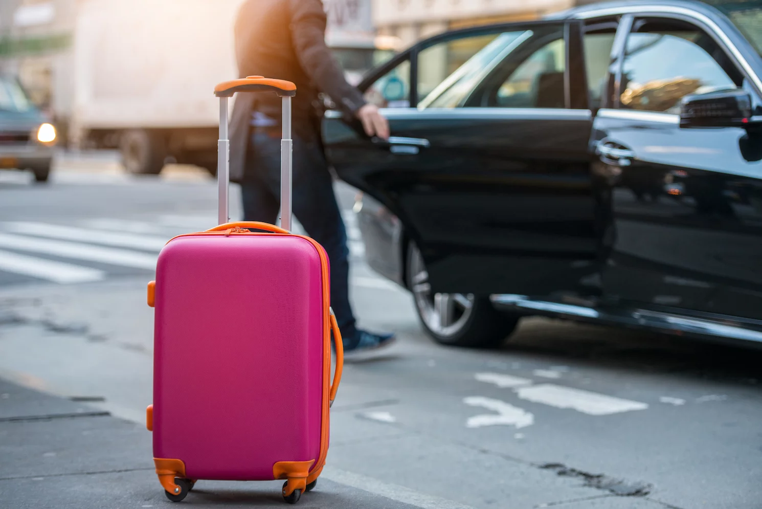 Chauffeur helping with luggage